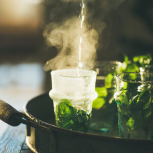 Fresh mint Moroccan tea with herb leaves in glasses